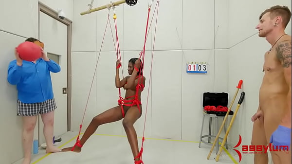 Bound ebony submissive from ceiling